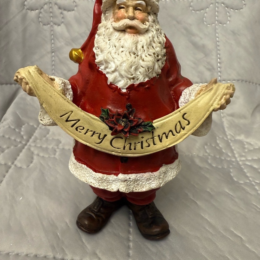 Festive Santa Claus Figurine Holding A Banner Red and White